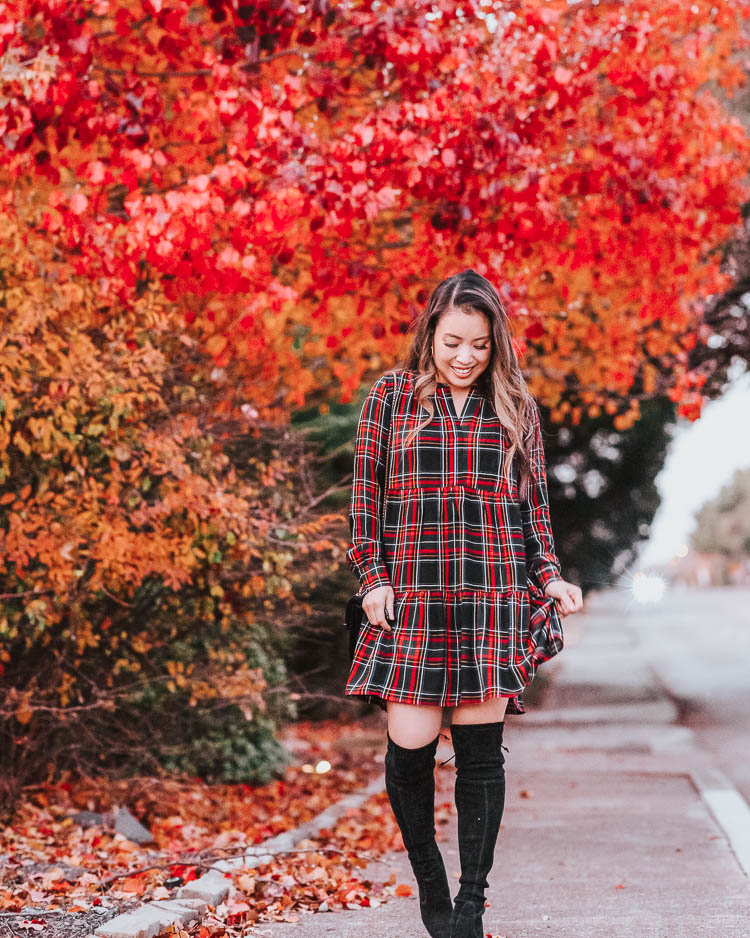 cute & little | dallas petite fashion blog | styling plaid for christmas holidays | LOFT plaid swing dress, black otk boots | How to Style Plaid For The Holidays by popular Dallas petite fashion blog, Cute and Little: image of a woman wearing a Loft PLAID TIERED SWING DRESS, Nordstrom Stewart Weitzman Ledyland Over the Knee Boot, and Kendra Scott Mayra Gold Hoop Earrings In Dichroic Glass. 