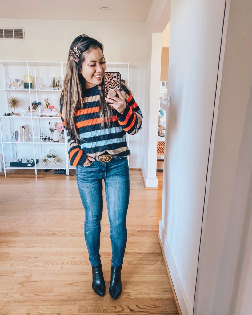 cute & little | dallas petite fashion blog | amazon striped sweater | casual winter outfit | Affordable Winter Sweaters To Break That January Funk by popular Dallas petite fashion blog, Cute and Little: image of a woman wearing SUPER HIGH-WAISTED JEGGING, Gucci Leather belt with Double G buckle, Amazon KIRUNDO Women’s Strip Color Block Short Sweater, Nordstrom Gigietta Bootie, Express Set Of 4 Resin Star Hair Clips, and holding a smart phone in a Amazon Sonix Watercolor Leopard Case. 
