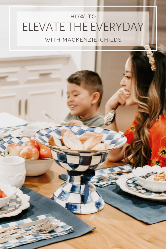 cute & little | mackenzie childs royal check dining table setting spring tablescape | family dining table setup | A MacKenzie Childs Kitchen by popular Dallas life and style blog, Cute and Little: image of a family sitting together at a table set with Mackenzie Childs items. 