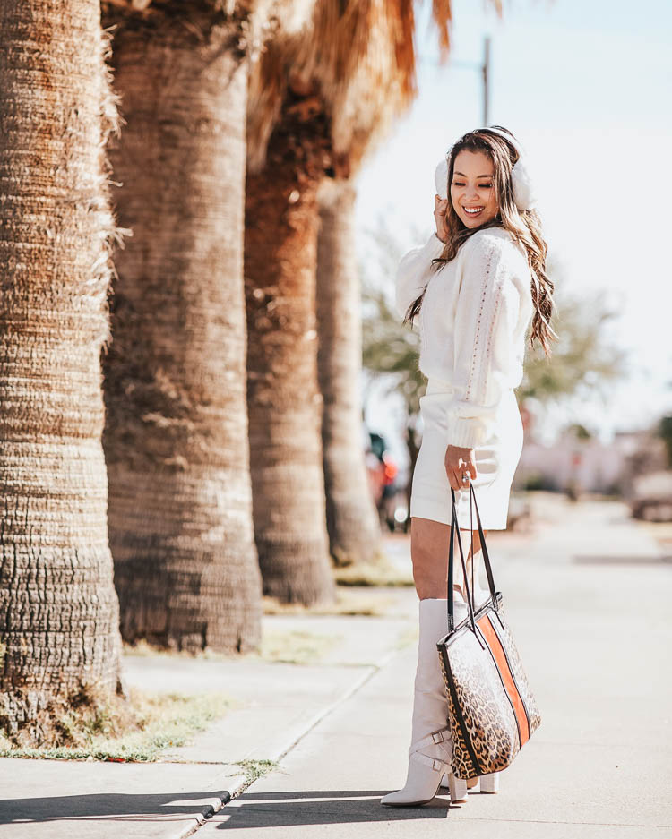 cute & little | dallas petite fashion blog | j.crew point sur sweater, j.crew white mini skirt, justfab white all or nothing white boots, white earmuffs, chico's leopard tote bag | winter white outfit