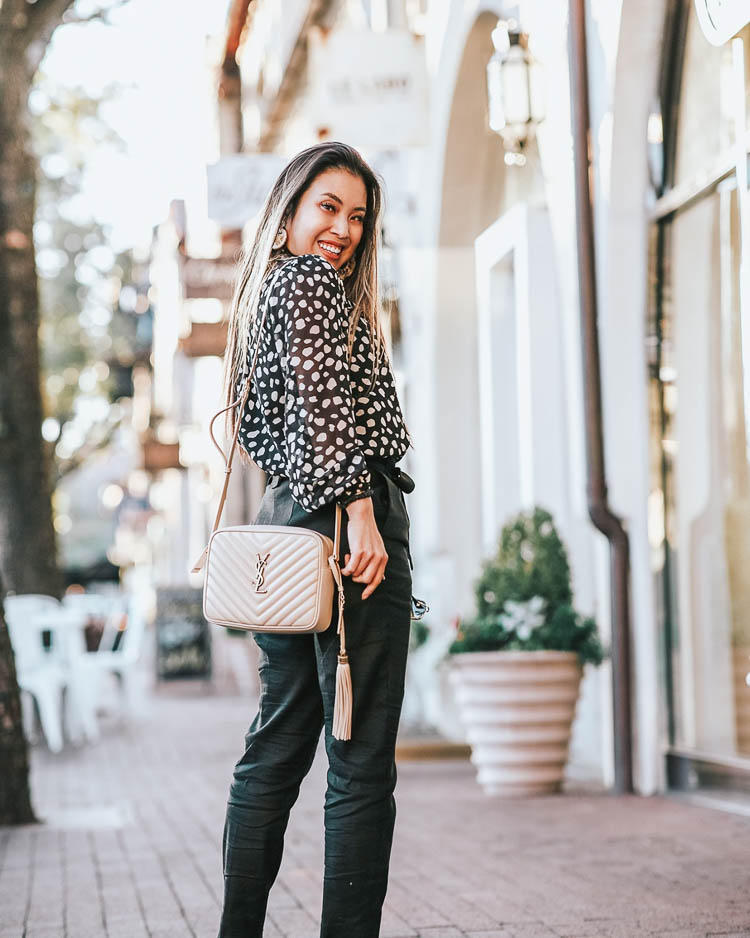 cute & little | dallas petite fashion blog | loft leopard blouse, express black high waisted trouser pants, ysl lou camera bag | spring work outfit | how to wear animal print to work | How-To Wear the Leopard Print Trend To The Office by popular Dallas petite fashion blog, Cute and Little: image of a woman wearing a J. Crew Classic lady day coat in Italian double-cloth wool with Thinsulate, Loft PETITE SPOTTED RUFFLE YOKE BLOUSE, Express High Waisted Plaid Sash Tie Ankle Pant, Sole Society black heel, Amazon BEST LADY Fashion Cute DIY Animal Beaded Earrings, Amazon Gucci GG 0106 S- 002 002 HAVANA, and Nordstrom Lou Matelassé Leather Camera Bag SAINT LAURENT.