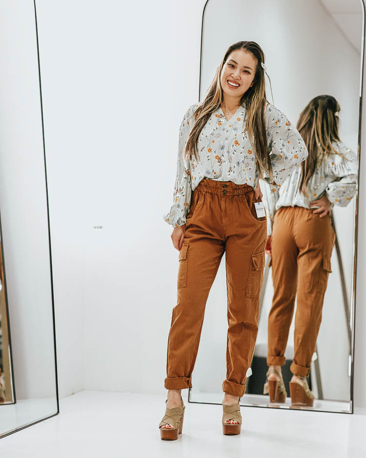cute & little | dallas petite fashion blog | penney's styling room review | jcpenney spring try-on haul | JCPenney Favorites by popular Dallas fashion blog, Cute and Little:  image of a woman in a JCPenney dressing room wearing a JCPenney a.n.a Womens Long Sleeve Blouse, JCPenney Arizona-Juniors Womens High Waisted Straight Fit Ankle Pant, JcPenney a.n.a Womens Dorian Wedge Sandals, and Amazon Pearls Hair Clips for Women.