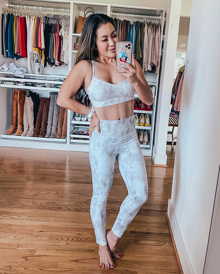cute & little | dallas fitness lifestyle blogger | at home workouts | Best Online Home Workouts by popular Dallas lifestyle blog, Cute and Little: image of a woman wearing a Target Women's Printed Low Support Strappy Long Line Bra and Target Women's Marble Print Contour Power Waist High-Rise 7/8 Leggings 24".