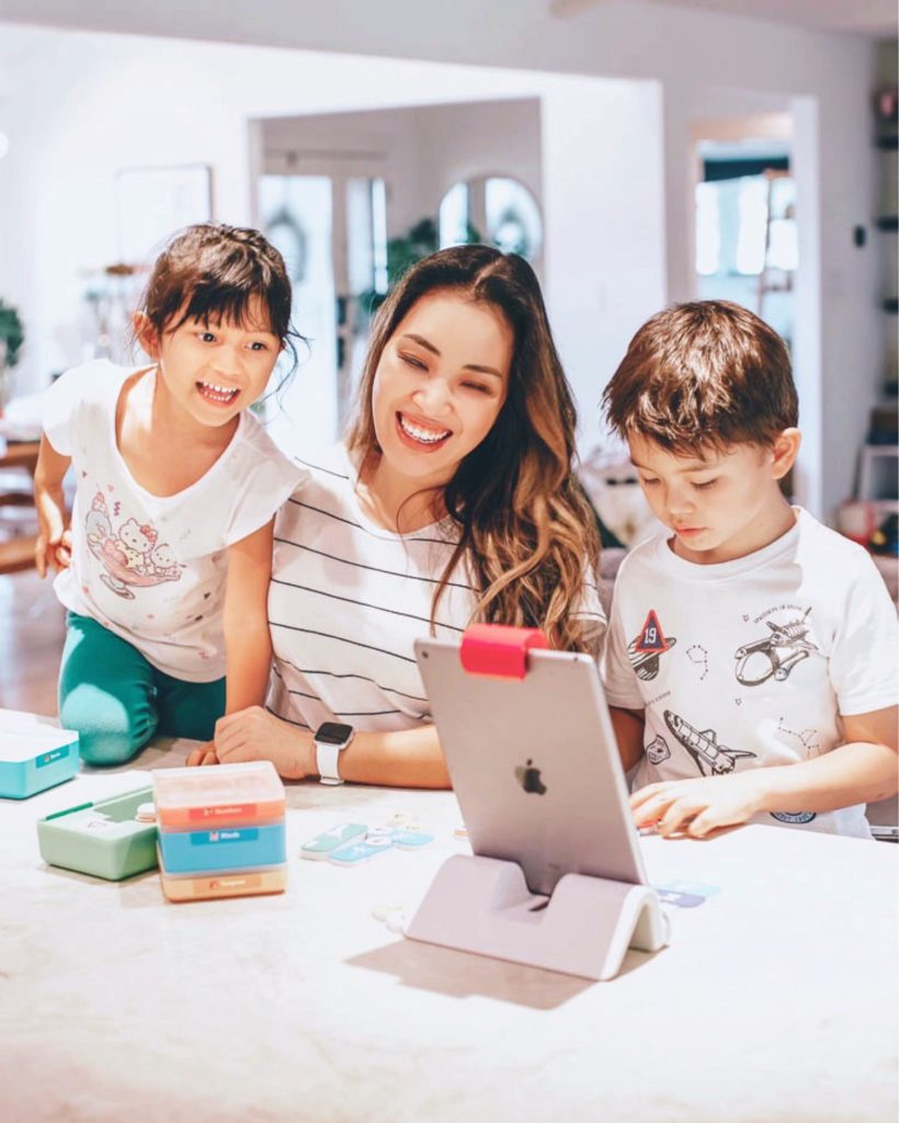 cute & little | stem education learning at home | osmo review | Stem Games by popular Dallas lifestyle blog, Cute and Little: image of a mom and her kids using an Osmo genius starter kit. 