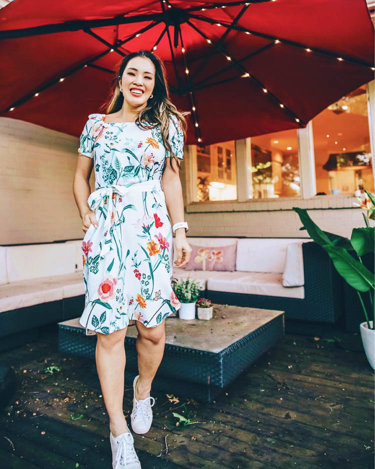 cute & little | loft april try-on | loft floral puff sleeve midi dress, white trask sneakers | spring outfit | Loft Try On by popular Dallas fashion blog, Cute and Little: image of a woman wearing a LOFT Floral Puff Sleeve Midi Dress, Trask 'Lindsey' Sneakers, Baublebar 'Biscay' Huggie Hoops