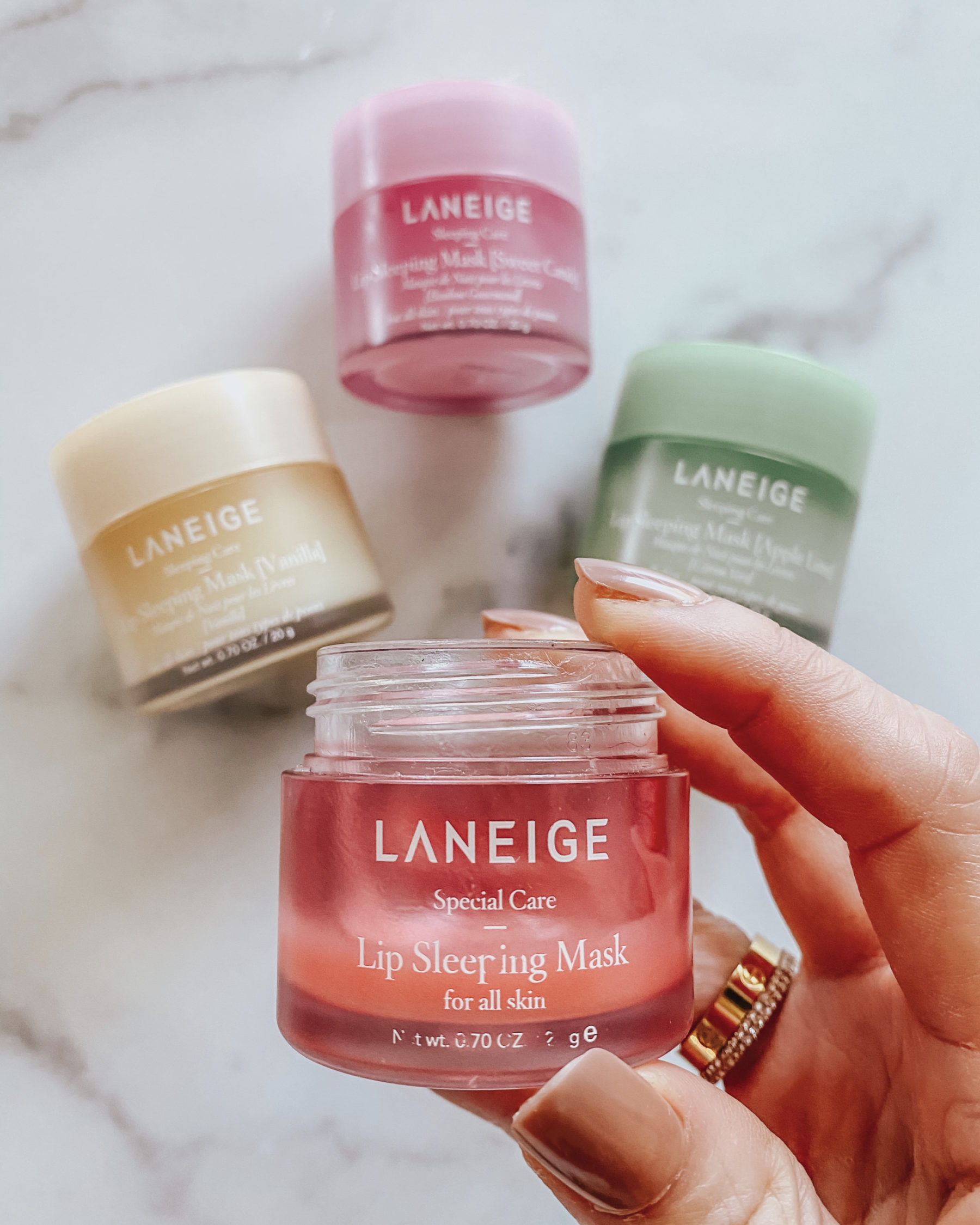 cute & little | dallas beauty blog | hacks tips no makeup work office look | fave lip moisturizer chapstick laneige sleeping mask |Walmart Self Care Products by popular Dallas lifestyle blog, Cute and Little: image of a woman holding a container of Laneige lip sleeping mask. 