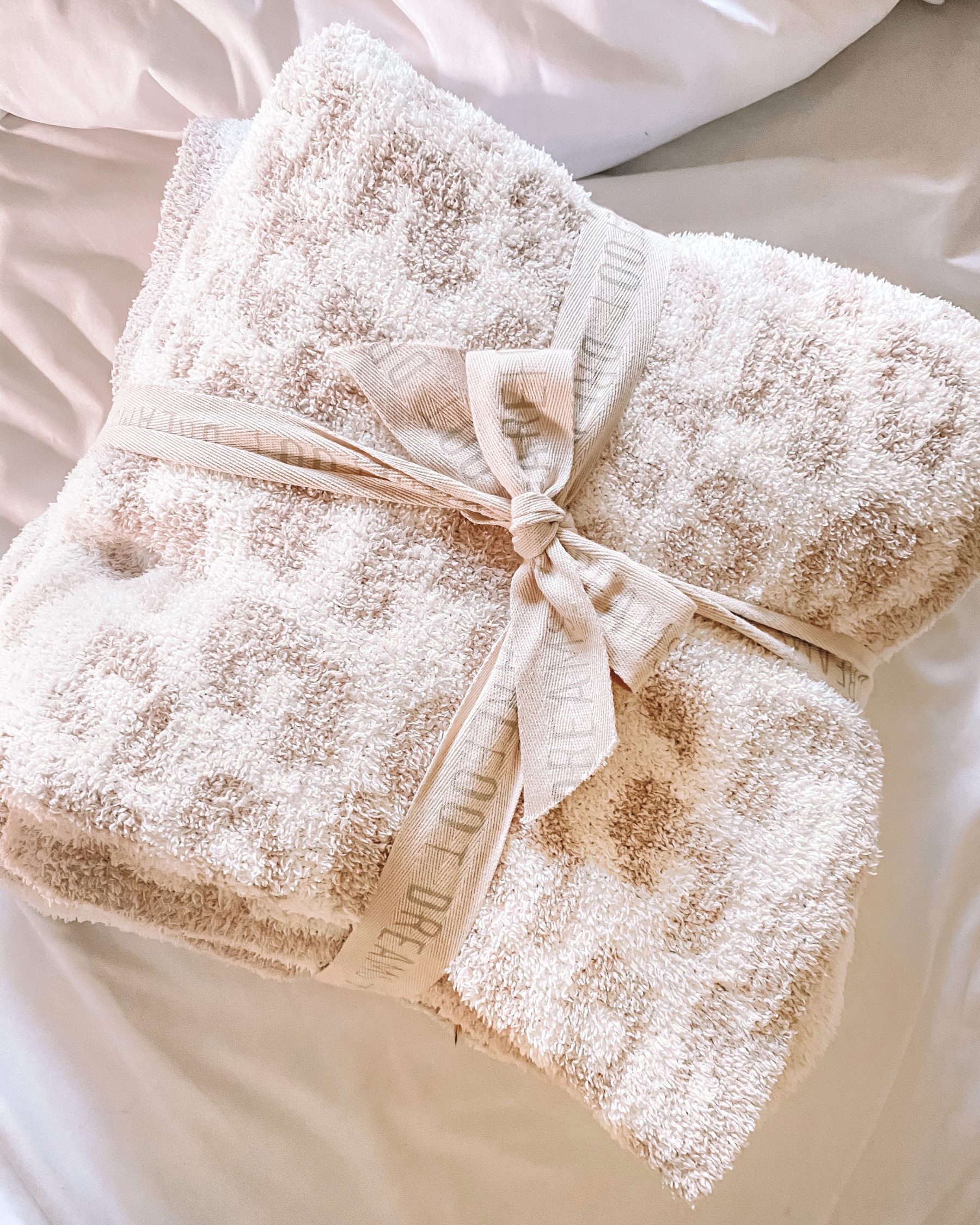 cute & little | dallas petite fashion blog | nordstrom anniversary sale 2020 nsale | barefoot dreams in the wild leopard throw blanket | Nordstrom Anniversary Sale by popular Dallas petite fashion blog, Cute and Little: image of a Barefoot Dreams In the Wild Throw blanket. 