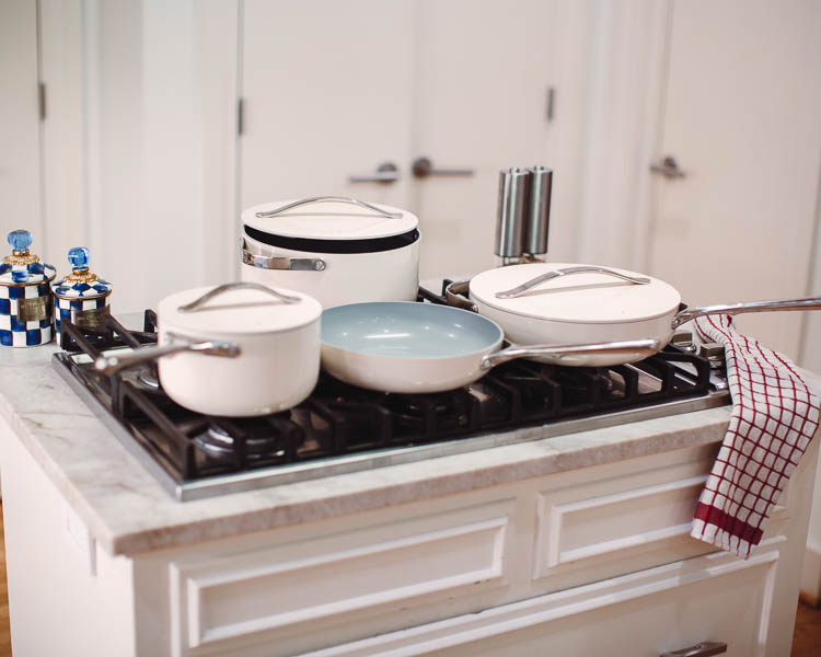 cute & little | dallas lifestyle mom blog | caraway home ceramic cookware set review | Caraway Cookware by popular Dallas lifestyle blog, Cute and Little: image of a Caraway Cookware set on a gas range stovetop. 