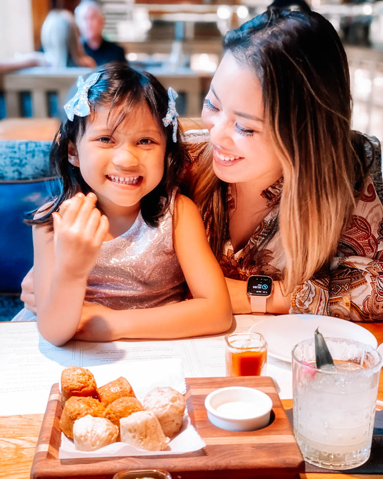 cute & little | dallas family mom travel blog | ritz-carlton dallas staycation | fearings restaurant | Family Staycation by popular Dallas lifestyle blog, Cute and Little: image of a mom and daughter eating at Fearing's restaurant. 