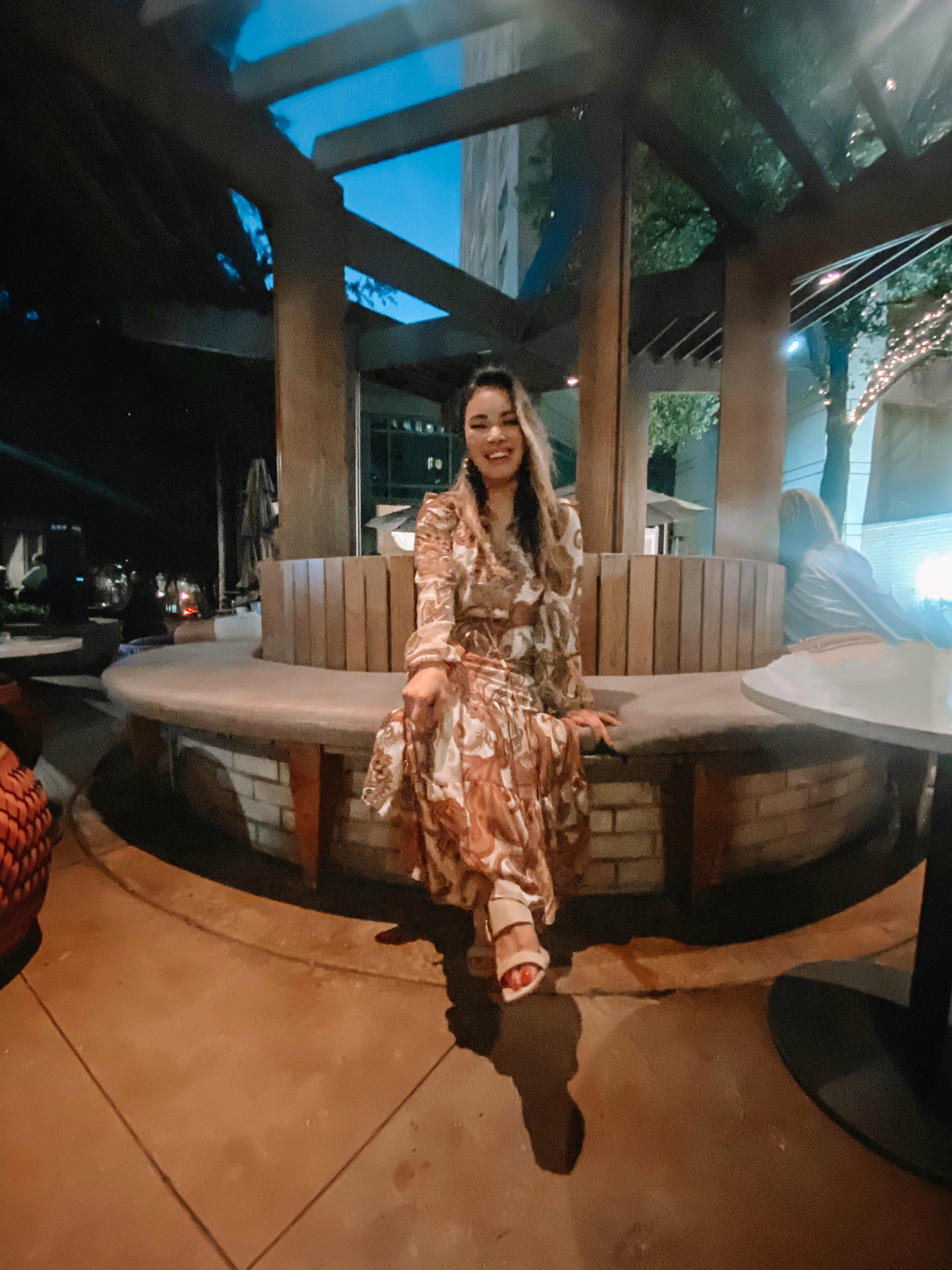 cute & little | dallas family mom travel blog | ritz-carlton dallas staycation | fearings rattlesnake bar outside patio | Family Staycation by popular Dallas lifestyle blog, Cute and Little: image of a woman at the Rattlesnake Bar at The Ritz-Carlton in Dallas. 