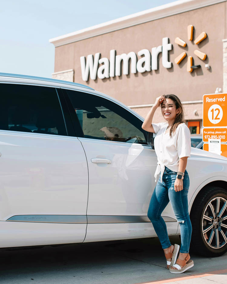 cute & little | dallas mom lifestyle blog | walmart online delivery grocery pickup review | Walmart Grocery Pickup Faq by popular Dallas lifestyle blog, Cute and Little: image of a woman standing in front of her car in a Walmart parking lot.  