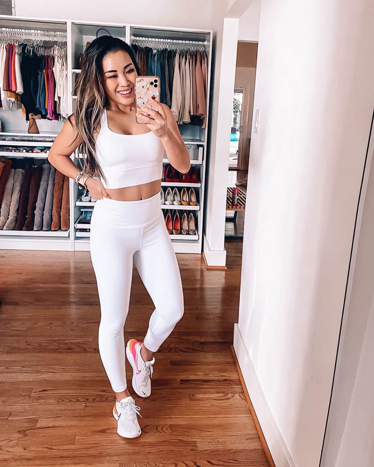 cute & little | dallas mom fitness blog | athleta roundup | tips to keep workout clothes looking new | Workout Clothing by popular Dallas petite fashion blog, Cute and Little: image of a woman wearing an Athleta warrior longline bra and Athleta Elation leggings. 