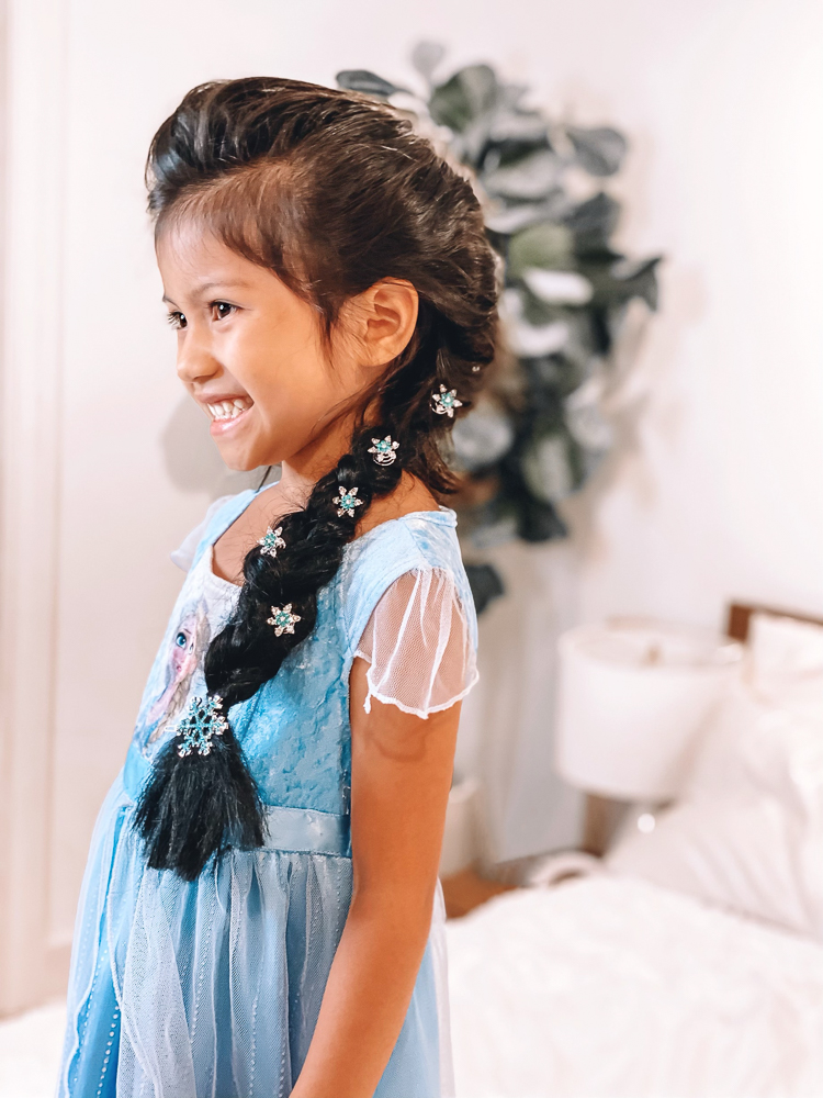 cute & little | disney frozen elsa french braid hair tutorial | tangle teezer hair brush review |Elsa Braid by popular Dallas beauty blog, Cute and Little: image of a girl with an Elsa braid accented with snowflake hair clips and wearing a Elsa dress. 