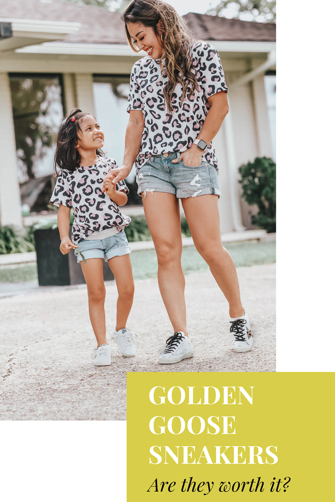 cute & little | dallas petite fashion mom blog | golden goose superstar sneakers review dupes | mommy daughter matching outfits |Golden Goose Sneakers by popular Dallas petite fashion blog, Cute and Little: image of a mom and daughter wearing matching leopard print tops, Express denim shorts, GOLDEN GOOSE Superstar leather sneakers, and Amazon LanXi Girls Kids Spring Sparkle Star Bling Sequins Sneakers.