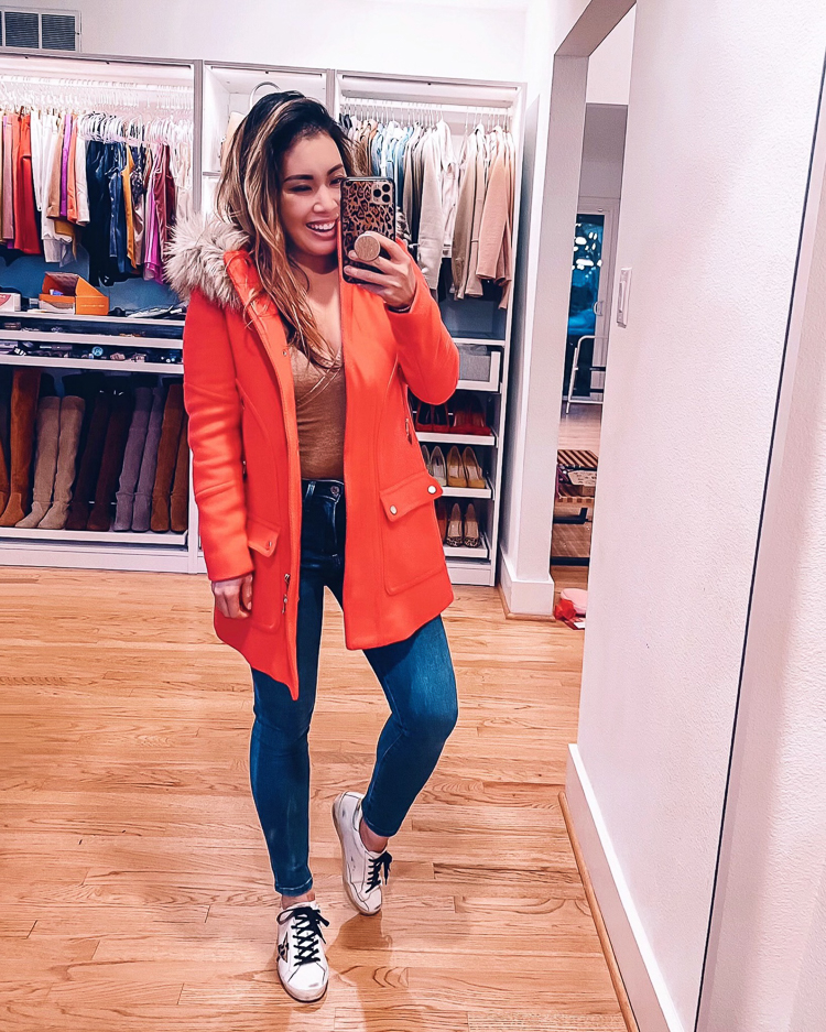 cute & little | dallas petite fashion blog | 2020 black firday cyber monday sales | j.crew chateau parka |Cyber Monday Sales by popular Dallas petite fashion blog, Cute and Little: image of a woman wearing a chateau parka, brown bodysuit, jeans, and Golden Goose sneakers. 