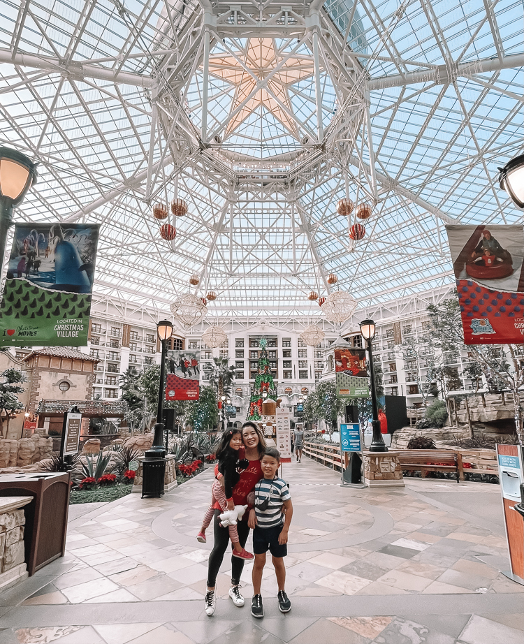 cute & little | dallas family mom blog | gaylord texas lone star christmas review |Gaylord Texan by popular Dallas lifestyle blog, Cute and Little: image of a mom and her two kids standing inside the Gaylord Texan. 