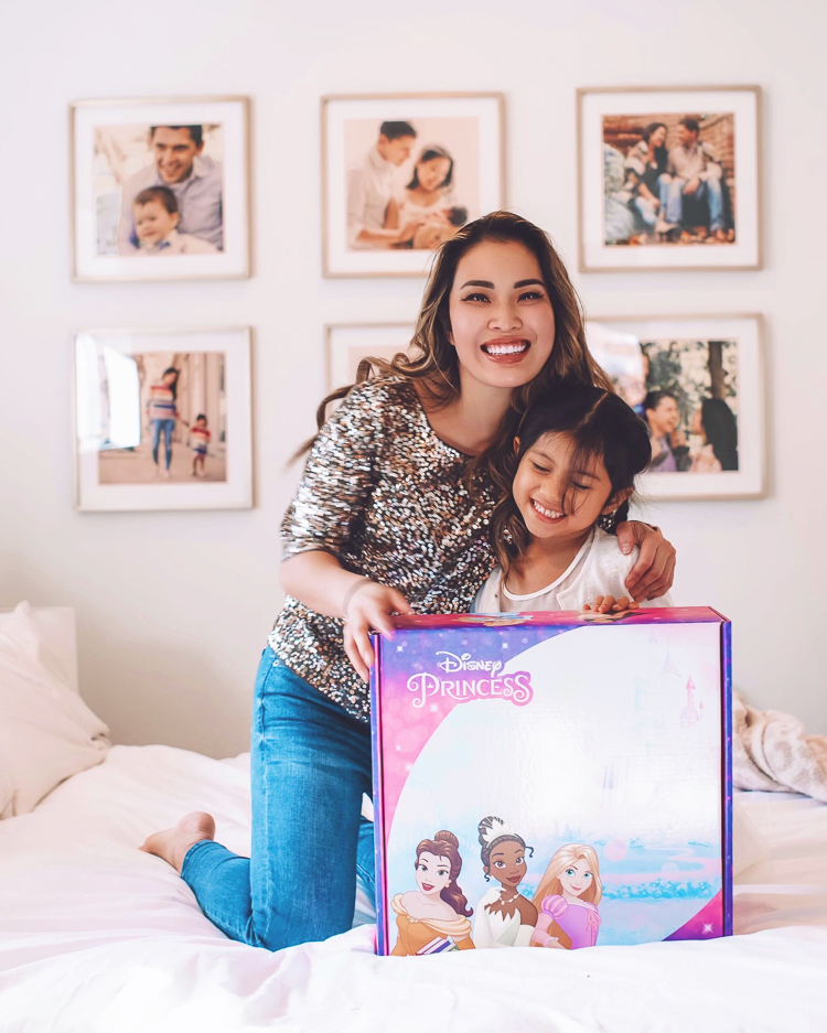 cute & little | dallas petite fashion blog | hasbro disney princess royal shimmer fashion doll unboxing review | girls holiday 2020 gift guide idea | Disney Princess Dolls by popular Dallas lifestyle blog, Cute and Little: image of a woman and her daughter sitting behind a Disney princess dolls box. 