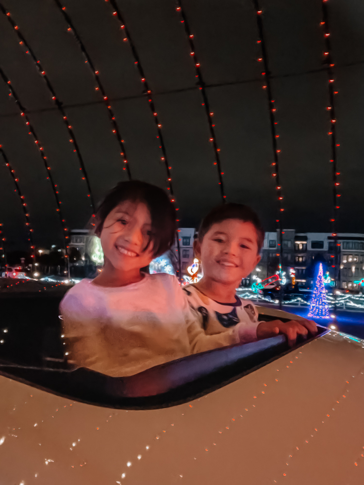 cute & little | dallas mom lifestyle blog | radiance frisco christmas light show review |Things to do in Frisco TX by popular Dallas travel blog, Cute and Little: image of two kids at Radiance! Frisco. 