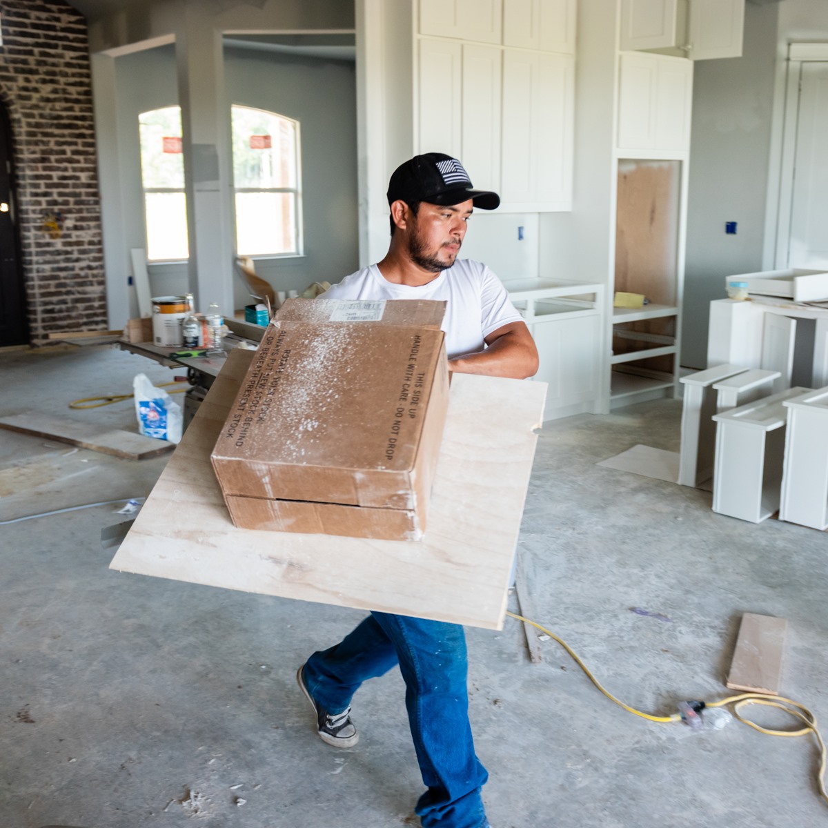 junk queen tx | collin county dallas dumpster rental |Amazon Organization Essentials by popular Dallas lifestyle Cute and Little: image of a man carrying a plywood board and a cardboard box. 