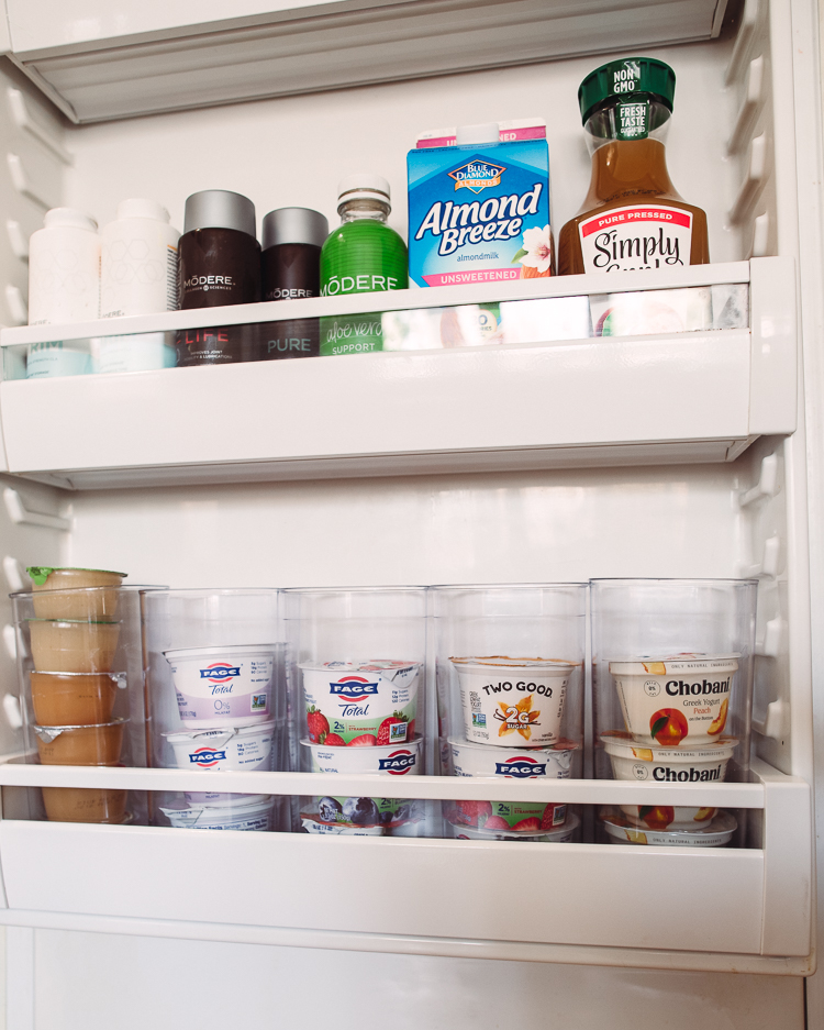 cute & little | dallas mom lifestyle blog | fridge organization tips and must-haves from walmart |Walmart Fridge Organization by popular Dallas lifestyle blog, Cute and Little: image of a fridge organized with acrylic containers. 
