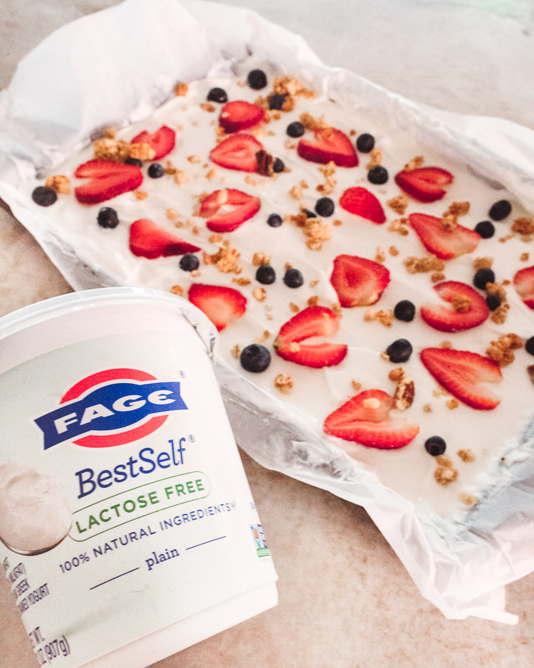 cute & little | dallas mom blog | summertime healthy snack | yogurt bark with berries | Yogurt Bark With Berries by popular Dallas lifestyle blog, Cute and Little: image of yogurt bark with berries next to a container of Fage yogurt. 