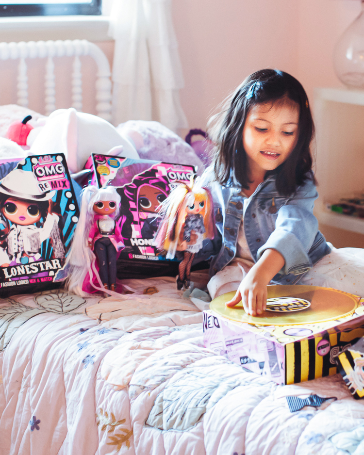 cute & little | dallas mom family travel blog | walmart pickup and delivery | summer kids' activities action figures | Fun Summer Activities by popular Dallas lifestyle blog, Cute and Little: image of a young girl playing with LOL dolls. 