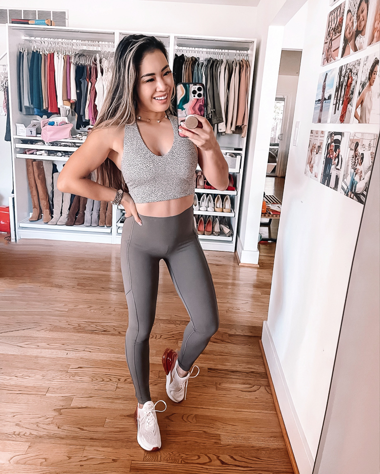 cute & little | dallas petite fashion fitness blogger | spanx booty boost every wear knockout leggings review, spanx longline sports crop | workout outfit | But Lifting Leggings by popular Dallas petite fashion blog, Cute and Little: image of a woman wearing a grey crop sports bra and grey Spanx booty boost every wear knockout leggings.