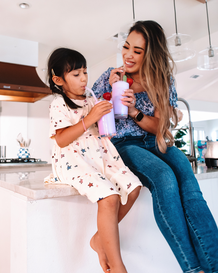 cute & little | dallas family lifestyle blogger | lactose-free taro smoothie recipe | fage bestself yogurt review | Taro Smoothie Recipe by popular Dallas lifestyle blog, Cute and Little: image of a mom and her daughter sitting together on their kitchen counter and drinking Taro smoothies. 