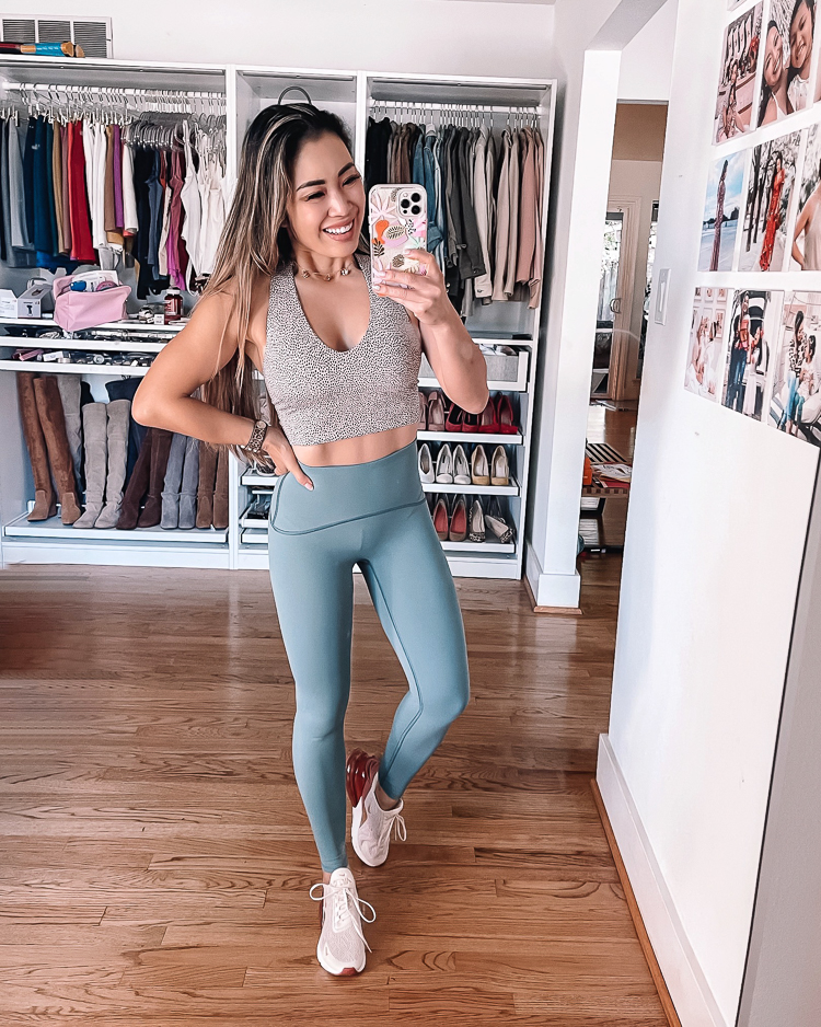cute & little | dallas petite fashion fitness blogger | spanx booty boost every wear active leggings review, spanx longline sports crop | workout outfit | But Lifting Leggings by popular Dallas petite fashion blog, Cute and Little: image of a woman wearing a grey crop sports bra and blue Spanx booty boost every wear knockout leggings.