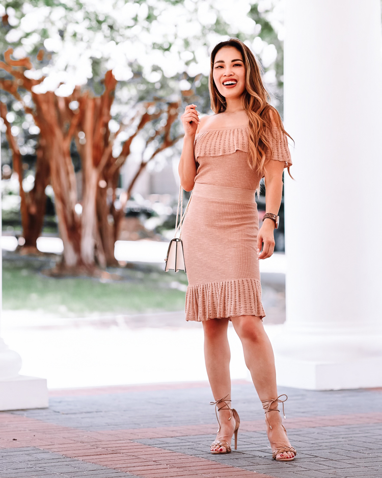 cute & little | dallas petite fashion blogger | express off shoulder sweater skirt set | summer wedding guest outfit | Matching Two Piece Skirt Set by popular Dallas petite fashion blog, Cute and Little: image of a woman wearing a Express knit skirt set with gladiator heeled sandals, and holding a cream and gold chain handbag. 