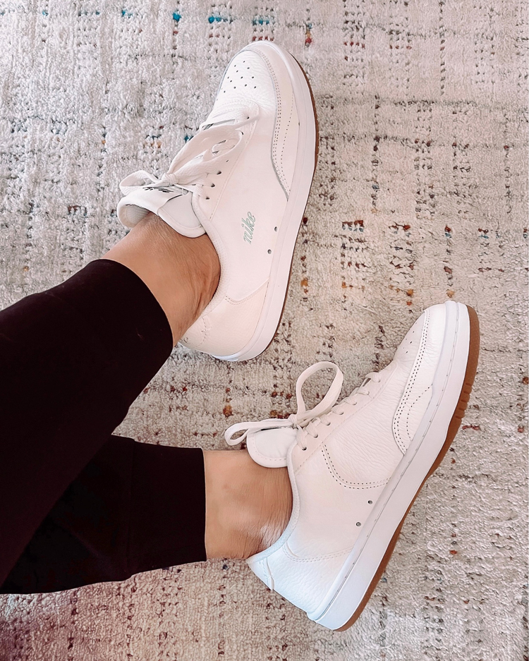 cute & little | dallas petite fashion blogger | nordstrom anniversary sale activewear outfits | nike court vintage sneakers | Nordstrom Anniversary Sale by pouplar Dallas petite fashion blog, Cute and Little: image of a woman wearing a Nordstrom black leggings and white Nike sneakers. 