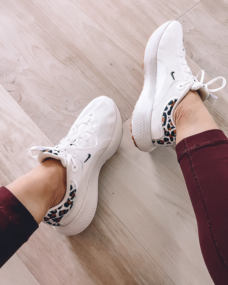 cute & little | dallas petite fashion blogger | nordstrom anniversary sale activewear outfits | nike escape react white leopard sneakers | Nordstrom Anniversary Sale by pouplar Dallas petite fashion blog, Cute and Little: image of a woman wearing a Nordstrom white and leopard print Nike sneakers. 