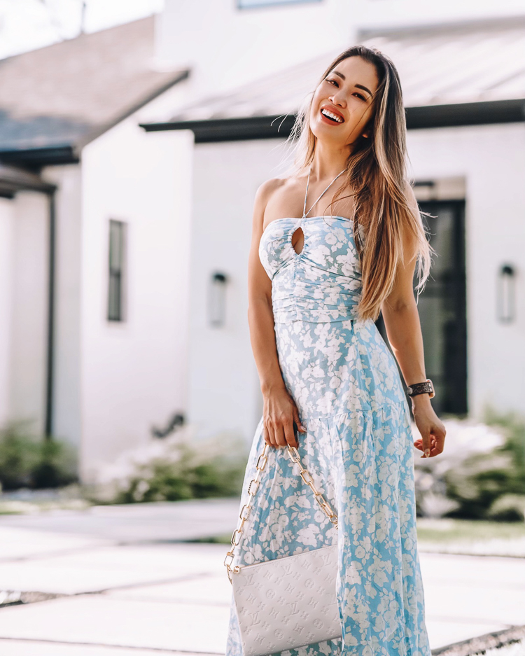 cute & little | dallas petite fasihon blog | abercrombie matching set blue floral maxi skirt dress | summer vacation outfit |  Life Update by popular Dallas lifestyle blog, Cute and Little: image of a woman standing outside her home and wearing a blue and white floral print cinched halter top maxi dress and tan strap sandals. 